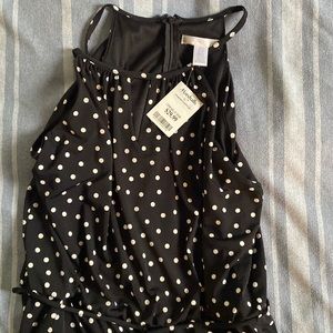 Brand New! Never worn. Polka dot jumper with pockets. Zipper back.